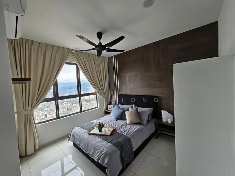 Bedroom features: king-size bed with upholstered headboard, grey bedding with decorative pillows, wood accent wall behind bed, floor-to-ceiling windows, city view, curtains in light beige, ceiling fan with light, white bedside table, decorative plant on bedside table, white wardrobe, tile flooring, air conditioning unit; style: modern; view: city.