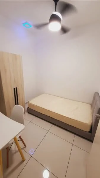 Bedroom features: single bed, upholstered bed frame, white walls, ceiling fan with light, tile flooring, wooden wardrobe with two doors, study desk with chair, no visible decor; style: modern.