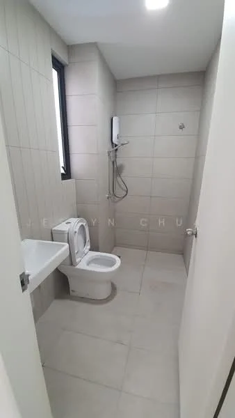 Bathroom features: white ceramic toilet, wall-mounted shower with handheld attachment, single sink with wall-mounted faucet, grey tiled walls, light grey floor tiles, window for natural light, mirror above sink, shower head, wall-mounted water heater; style: modern.