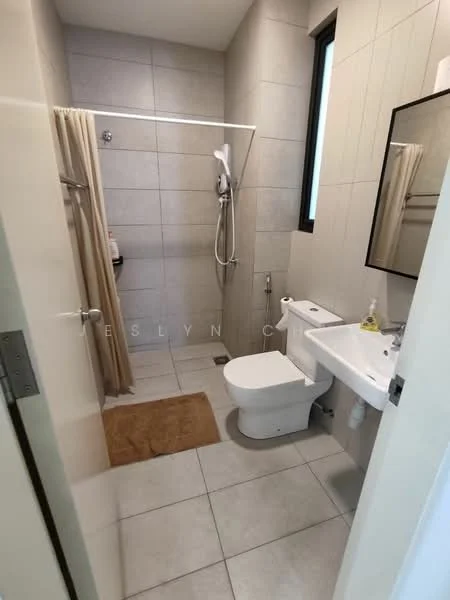 Bathroom features: walk-in shower with glass enclosure, chrome handheld shower, white ceramic toilet, single-sink vanity with white cabinet, framed mirror, beige bath mat, grey tiled walls, light grey floor tiles; style: modern.