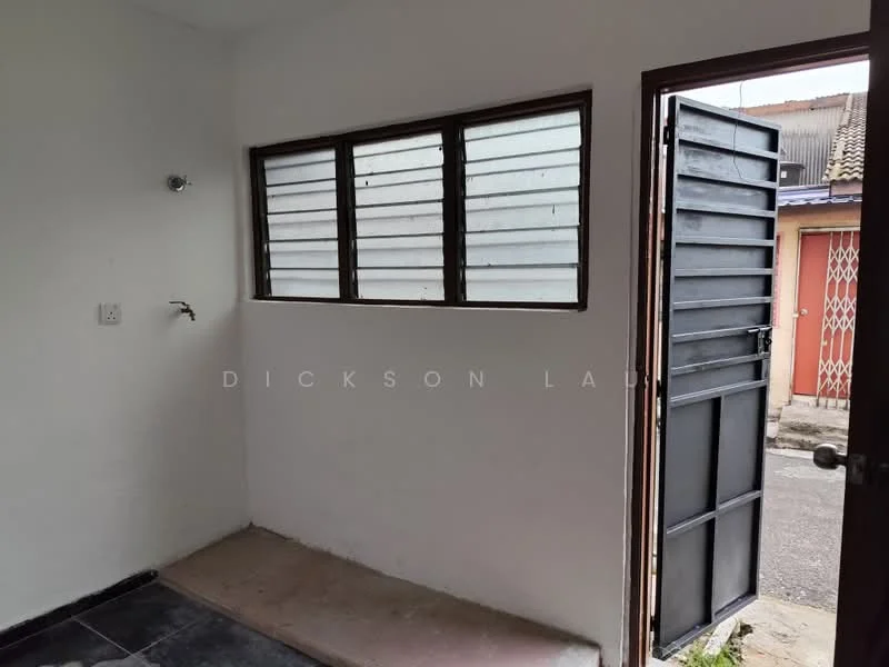 Room features: white painted walls, black tile flooring, single window with horizontal slats, metal door, door frame, exposed electrical outlet, concrete floor, natural light from window; style: minimalist; view: street.