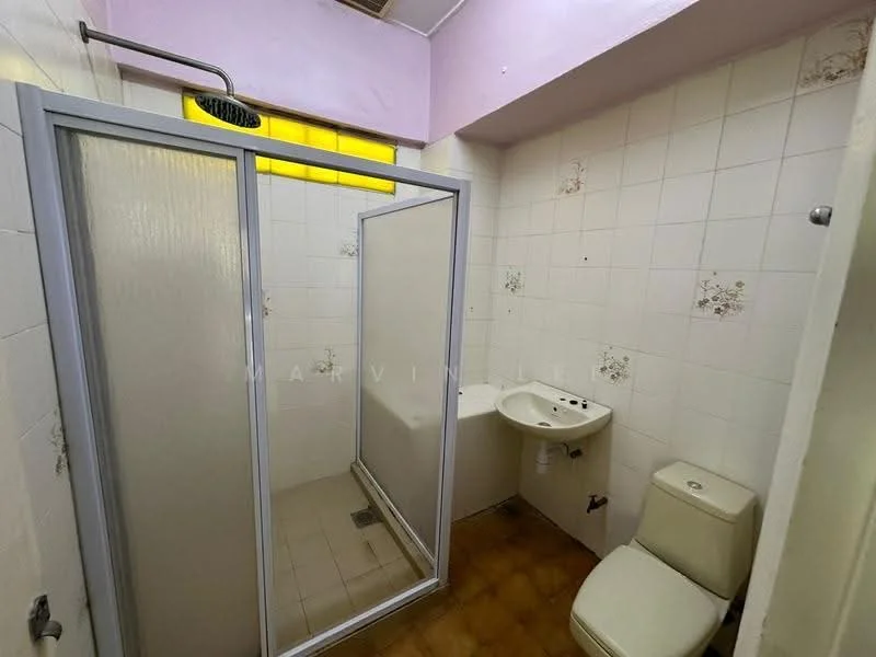 Bathroom features: shower enclosure with sliding door, rain shower head, white tiled walls, cream tiled flooring, single-sink vanity with wall-mounted faucet, toilet, mirror above sink, decorative floral tiles, window for natural light.