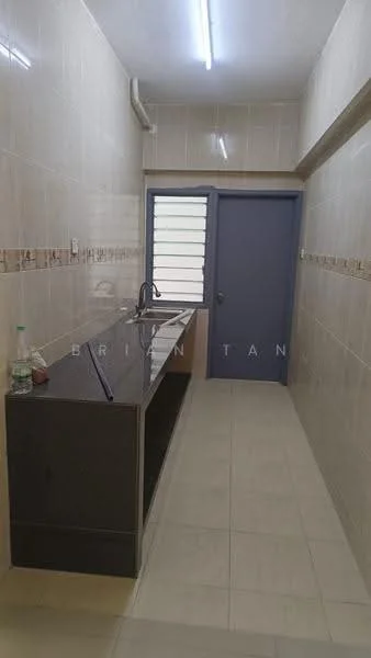 Kitchen features: single-bowl stainless-steel sink, chrome pull-down faucet, black granite countertop, cream tiled backsplash, light beige wall tiles, white ceiling, fluorescent lighting, grey door, window with metal grilles, floor tiles in light beige; style: modern.