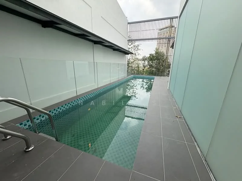 Exterior type: swimming pool deck; features: infinity pool, glass railing, tiled pool deck, green mosaic tiles in pool, stainless-steel handrails, surrounded by greenery, modern architectural design, partial wall with frosted glass, open sky view; style: modern.