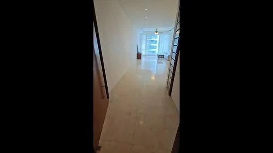 Hallway features: marble flooring, white painted walls, recessed downlights, large windows with sheer curtains, open layout, ceiling light fixture, doorway leading to living area, natural light from windows; style: modern; view: city.