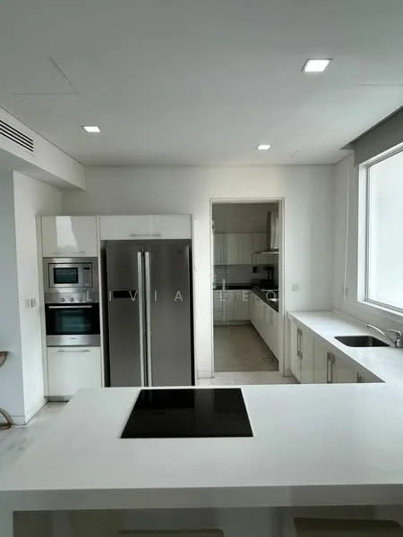 Kitchen features: white cabinetry, stainless-steel double-door fridge, built-in oven, microwave, black induction cooktop, white countertop, tile backsplash, under-cabinet lighting, window with natural light, open layout to adjacent room; style: modern.