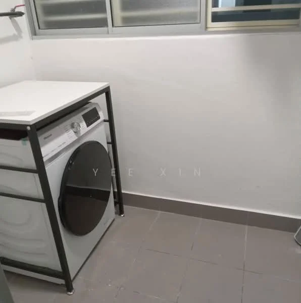 Laundry features: front-load washing machine, white metal frame table, grey tiled flooring, white painted walls, window with horizontal bars, shelving above washing machine.