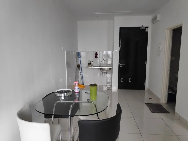 Dining features: glass dining table, 4 dining chairs, white tiled flooring, white painted walls, recessed ceiling lights, cleaning supplies on table, kitchen area visible in background, black door, open layout; style: modern. Kitchen features: stainless-steel sink, wall-mounted faucet, countertop, kitchen utensils visible, white cabinetry, open shelving, tile backsplash; style: modern.
