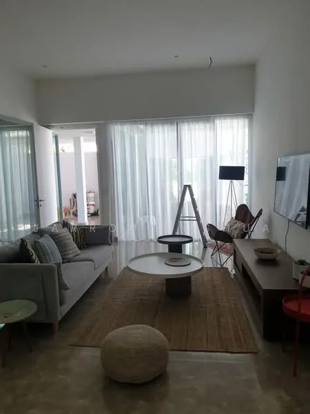 Living features: grey fabric sofa, round coffee table, wooden TV console, wall-mounted TV, area rug, floor-to-ceiling windows, sheer curtains, decorative floor lamp, decorative chair, light-colored walls, polished concrete flooring; style: modern.