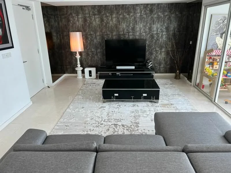 Living features: grey fabric sectional sofa, black coffee table, white floor lamp, flat-screen TV on console, decorative wall with dark textured finish, light-colored area rug with abstract pattern, large glass sliding door, children's play area visible, decorative branches in vase, white wall with door, built-in cabinetry; style: modern; view: garden.