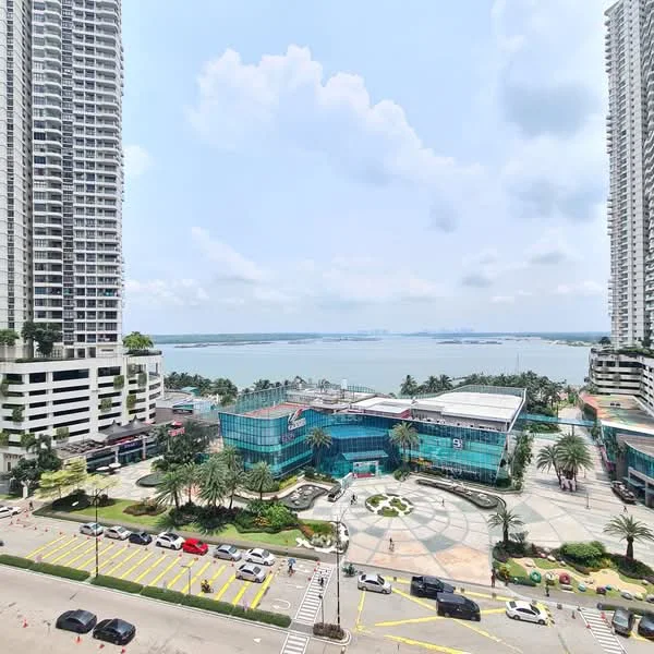 Exterior type: high-rise condominium; features: glass curtain wall, surrounded by palm trees, manicured landscaping, waterfront view, open plaza area, multiple high-rise buildings, urban setting, parking lot, adjacent to water body; style: modern.