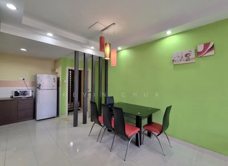 Dining features: green painted walls, white ceiling with recessed downlights, rectangular dining table in black, 4 black dining chairs with red upholstery, ceramic tile flooring, framed artwork on wall, microwave on countertop, stainless-steel fridge, open layout to kitchen area; style: modern. Kitchen features: brown cabinetry, countertop with space for appliances, unknown appliances; style: modern.