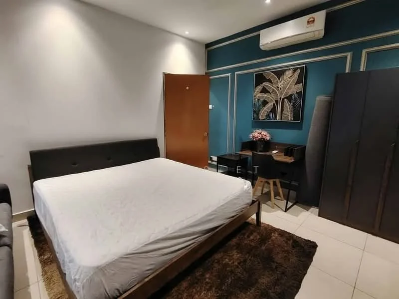 Bedroom features: queen-size bed frame without mattress, dark wood bed frame, upholstered headboard, wooden desk with chair, decorative wall art with plant motif, dark wardrobe, cream tiled flooring, air conditioning unit on wall, recessed lighting, brown area rug; style: modern.