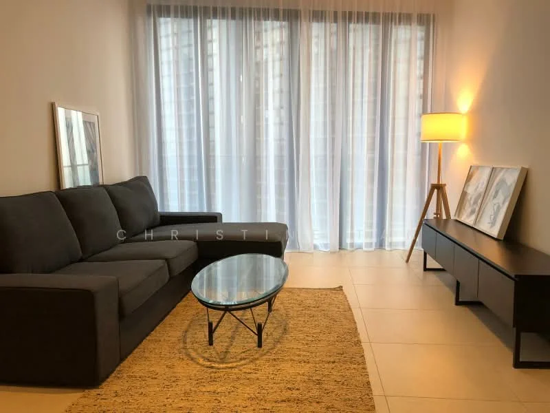 Living features: 3-seater fabric sofa in grey, glass coffee table with black metal legs, black TV console, area rug with neutral color, floor-to-ceiling windows with sheer curtains, lamp with warm light, framed artwork on wall, tile flooring; style: modern.