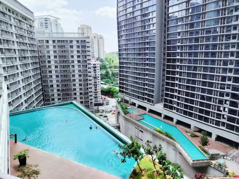 Exterior type: high-rise condominium; features: infinity pool, lap pool, surrounding greenery, concrete facade, glass curtain wall, multiple high-rise buildings, pool deck with loungers, landscaped garden areas; style: modern.