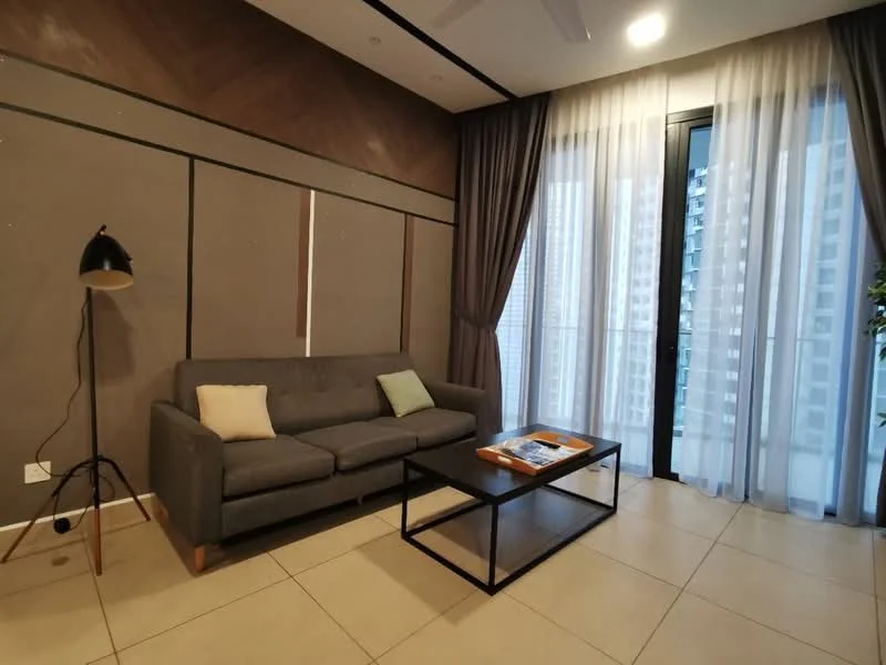 Living features: grey fabric sofa, light green cushion, black metal coffee table, floor lamp with black shade, large glass sliding doors, sheer curtains, wood panel accent wall, cream tile flooring, indoor plant; style: modern; view: city.