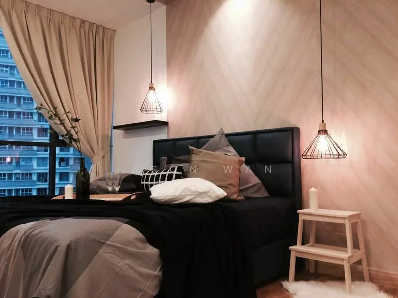 Bedroom features: king-size bed with black upholstered headboard, decorative pillows in various colors, bedside table in light wood, hanging pendant lights with wire frames, wooden flooring, textured accent wall with wood pattern, floor-to-ceiling window with sheer curtains, decorative vase with flowers, white throw blanket, area rug with fluffy texture; style: modern; view: city.