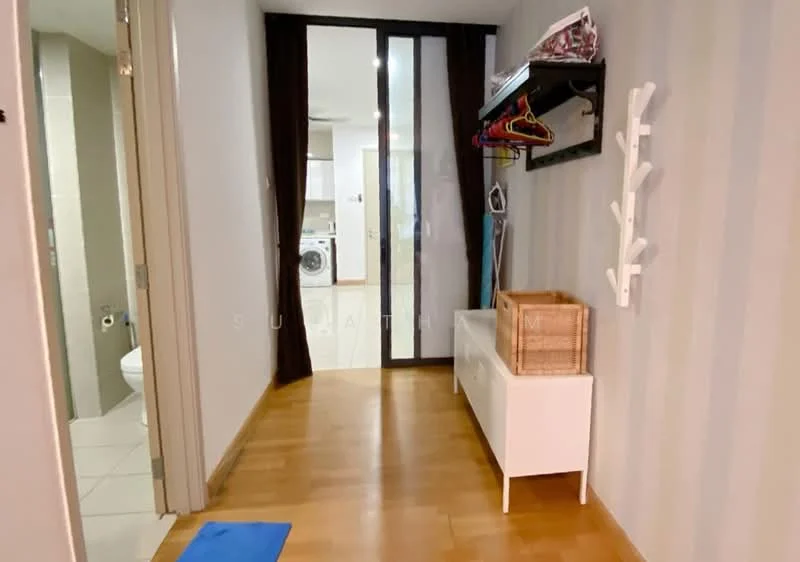 Hallway features: wooden flooring, striped wallpaper, white storage bench, wall-mounted coat rack, hanging clothes, sliding glass door, visible laundry area, doorway to bathroom; style: modern.