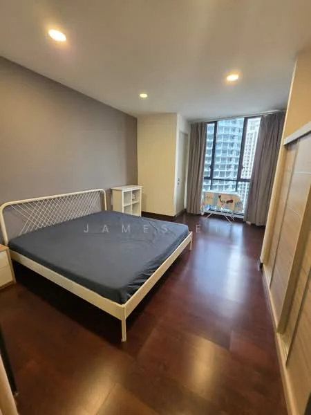 Bedroom features: queen-size bed, white metal bed frame, dark wood flooring, grey accent wall, built-in wardrobe with sliding doors, floor-to-ceiling windows, sheer curtains, city view, nightstand, light fixtures in ceiling; style: modern; view: city.