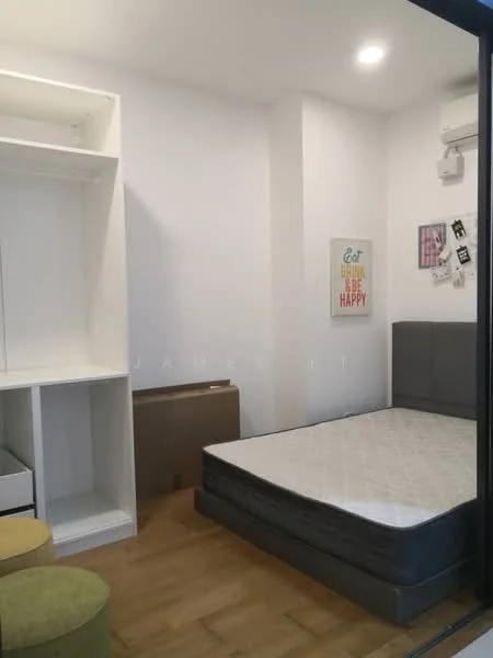 Bedroom features: wooden flooring, white painted walls, air conditioning unit, queen-size bed, upholstered headboard, built-in wardrobe with shelving, decorative wall art, window with natural light, green upholstered stools; style: modern.