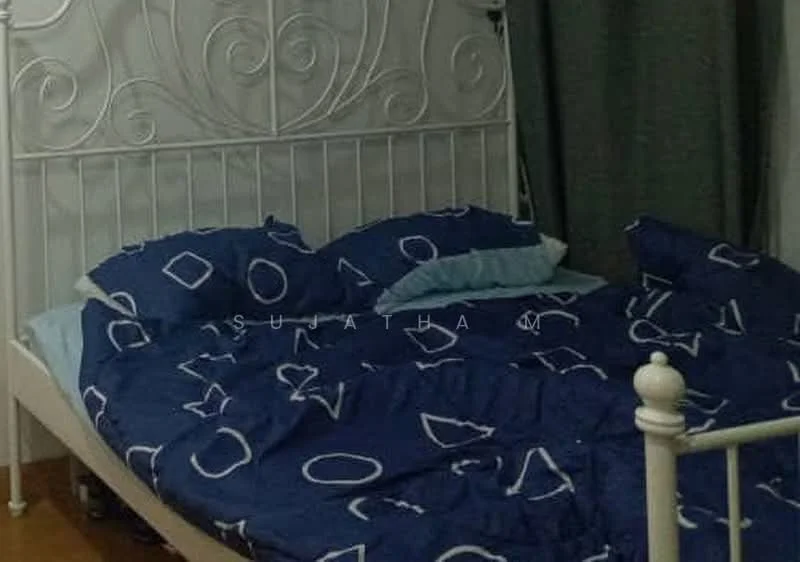 Bedroom features: metal bed frame in white, queen-size bed, blue bedding with geometric pattern, two blue pillows, wooden flooring, green curtains, decorative wall art, nightstand with lamp.