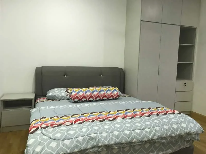 Bedroom features: king-size bed with grey upholstered headboard, decorative throw pillows, light blue patterned bedding, nightstand with drawer, built-in wardrobe with sliding doors, wooden flooring, white painted walls, ceiling light fixture; style: modern.
