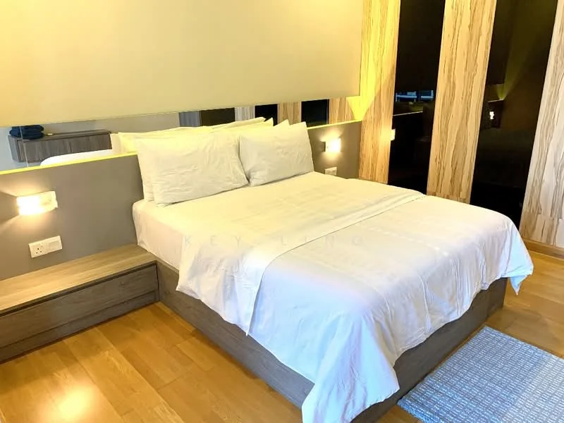 Bedroom features: queen-size bed, white bedding, wooden bed frame, nightstand with drawer, wall-mounted bedside lamps, light wood accent wall, laminate flooring, decorative area rug; style: modern.