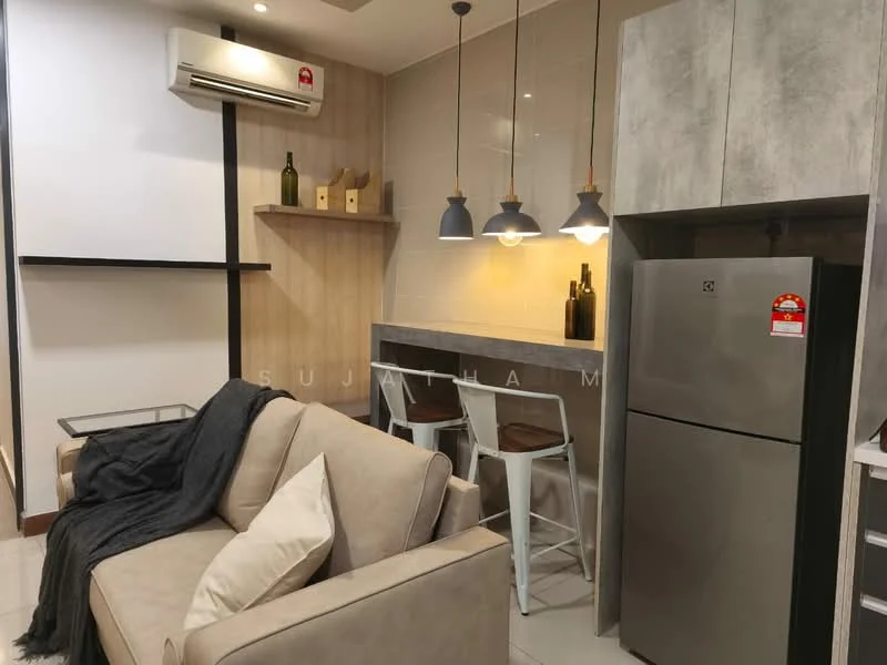 Living features: 3-seater fabric sofa in beige, refrigerator, pendant lighting with three fixtures, white bar stools, wooden wall paneling, grey accent wall, kitchenette with countertop, decorative bottles on shelves, air conditioning unit, white cabinetry; style: modern.