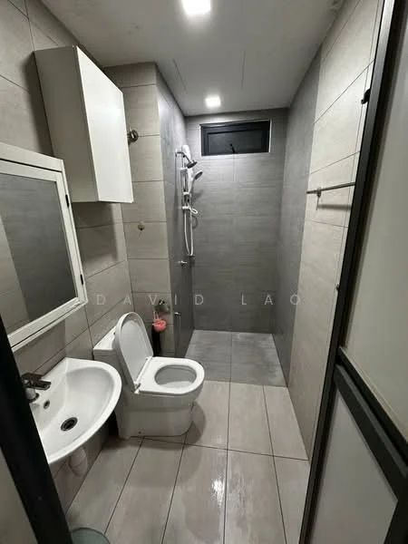 Bathroom features: grey tiled walls, light grey tiled flooring, walk-in shower with glass enclosure, chrome handheld shower, chrome wall-mounted faucet, white one-piece toilet, white sink with chrome faucet, mirror with frame, built-in cabinet above sink, window for natural light, towel rack, recessed ceiling lights; style: modern.