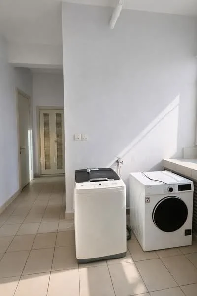 Laundry features: front-load washing machine, tumble dryer, white walls, tile flooring, natural light from window, utility sink, countertop for folding clothes, door leading to hallway.