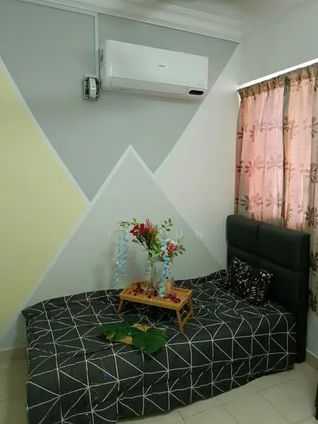 Bedroom features: grey painted walls with geometric pattern, cream painted wall, black upholstered headboard, single bed with patterned bedding, decorative tray with flowers, green leaves on tray, 1 wall-mounted split AC, curtains with floral pattern, tile flooring; style: modern.