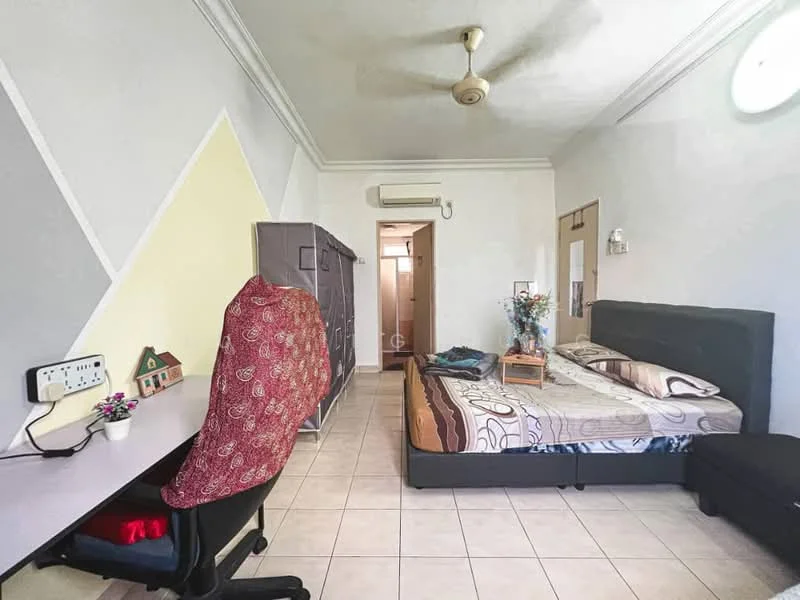 Bedroom features: queen-size bed with patterned bedding, upholstered headboard, study desk with chair, wall-mounted air conditioning unit, ceiling fan, built-in wardrobe, tiled flooring, decorative vase on bedside table, wall mirror, light-colored walls with accent design; style: modern.