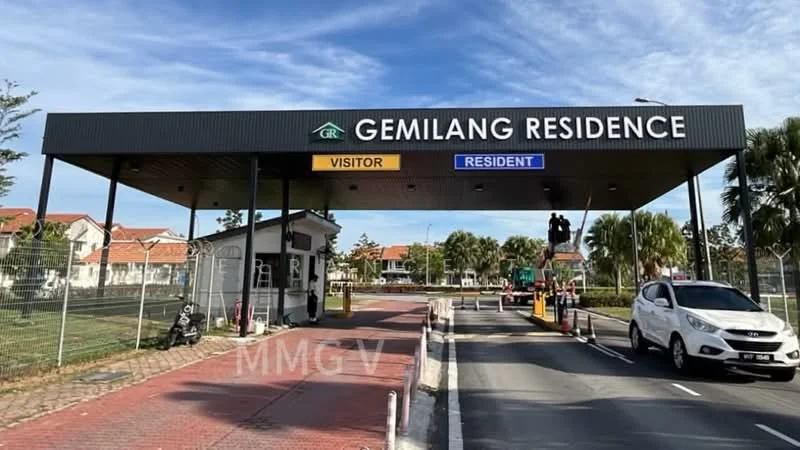 Exterior type: main entrance gate; features: guard house at entrance, visitor and resident lanes, security booth, paved driveway, landscaped greenery, parking area, signage for visitors and residents; style: modern.
