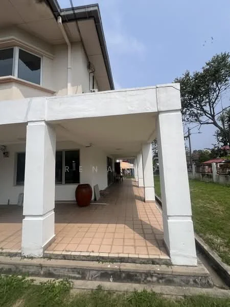 Exterior type: detached bungalow; features: white painted facade, flat roof, covered porch area, tiled flooring, manicured lawn, surrounded by greenery, visible outdoor space; style: modern.
