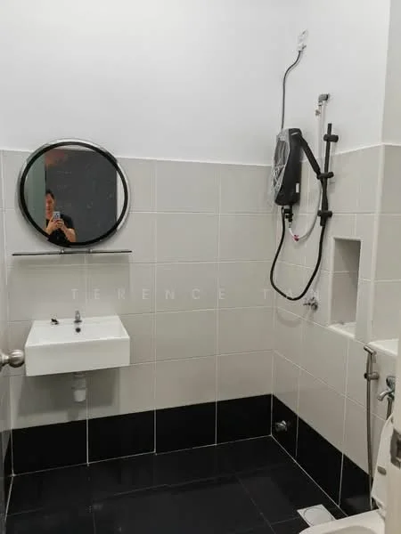 Bathroom features: white tiled walls, black tiled flooring, round mirror, wall-mounted showerhead, handheld shower, single-bowl sink, chrome faucet, toilet, wall-mounted soap dispenser, shower area with glass partition; style: modern.