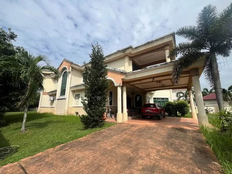 Exterior type: detached bungalow; features: two-storey building, cream painted facade, arched windows, covered porch, paved driveway, manicured lawn, tropical landscaping, palm trees, car parked in driveway, gabled roof, columned entrance, surrounded by greenery; style: modern.