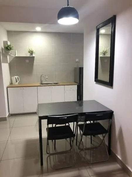 Kitchen features: grey tiled walls, white cabinetry, wood countertop, stainless-steel sink, chrome faucet, refrigerator, black dining table, 2 folding chairs, pendant light, floor tiles, decorative plants on shelves, mirror on wall; style: modern.