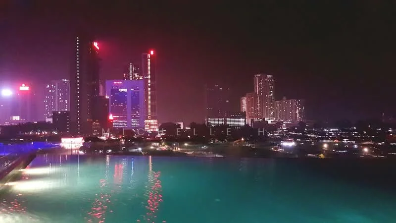 Exterior features: city skyline, night view, illuminated buildings, waterfront, reflections on water, high-rise buildings, urban landscape; style: modern.