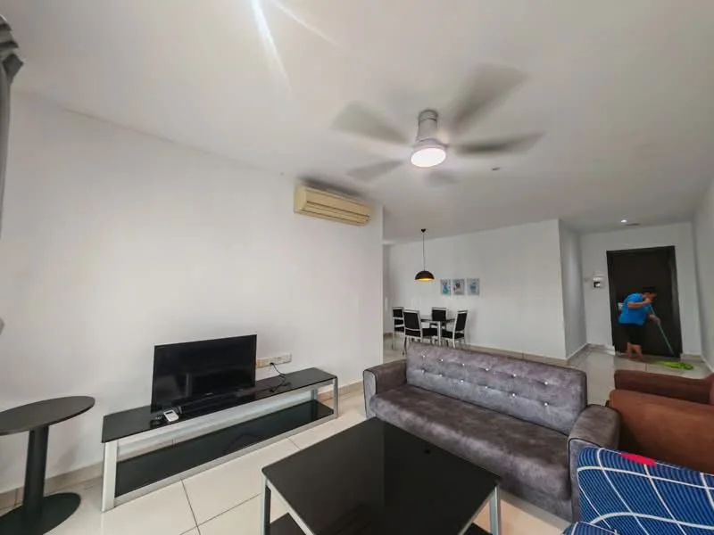 Living features: 3-seater grey fabric sofa, 2-seater grey sofa, black coffee table, wall-mounted TV, ceiling fan with light, 1 wall-mounted split AC, white painted walls, tile flooring, decorative artwork on wall, open layout to dining area; style: modern.