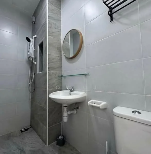 Bathroom features: grey tiled walls, white tiled flooring, walk-in shower with glass enclosure, rain shower head, handheld shower, round mirror, wall-mounted sink, chrome faucet, toilet, glass shelf, towel rack, soap holder; style: modern.