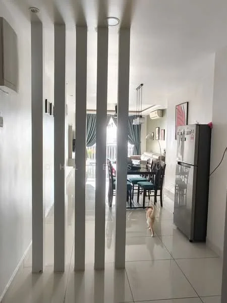 Room features: white painted walls, glossy tile flooring, recessed downlights, open layout, dining area with table and chairs, kitchen area with fridge, decorative wall art, curtains on windows, visible dog, partition with vertical slats; style: modern.