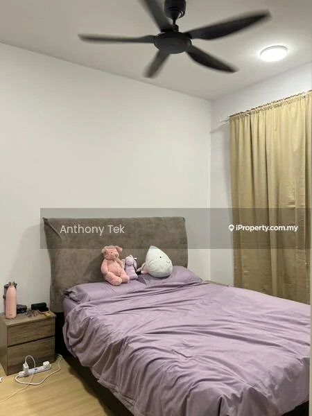 Bedroom features: king-size bed with purple bedding, upholstered headboard, 2 bedside lamps, wooden bedside table, 5-blade ceiling fan, recessed ceiling light, curtain on window, wooden flooring, stuffed toys on bed; style: modern.