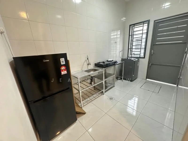 Kitchen features: white tiled walls, glossy white floor tiles, stainless-steel countertop, single-bowl stainless-steel sink, chrome pull-down faucet, freestanding fridge, freestanding gas stove, washing machine, window with security bars, metal door, open layout, shelving unit; style: modern.