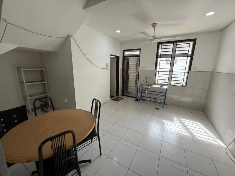 Room features: white painted walls, white tiled flooring, ceiling fan, windows with black frames, dining table with round wooden top, black metal chairs, shelving unit, utility table, door leading to hallway; style: modern.