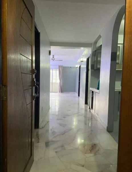 Hallway features: marble flooring, white painted walls, ceiling fan, arched doorways, natural light from windows, light-colored curtains, wooden front door with decorative panel; style: modern.