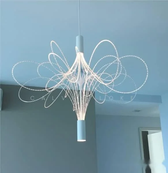 Room features: modern chandelier, suspended light fixture, white finish, intricate design, LED lighting; style: modern.
