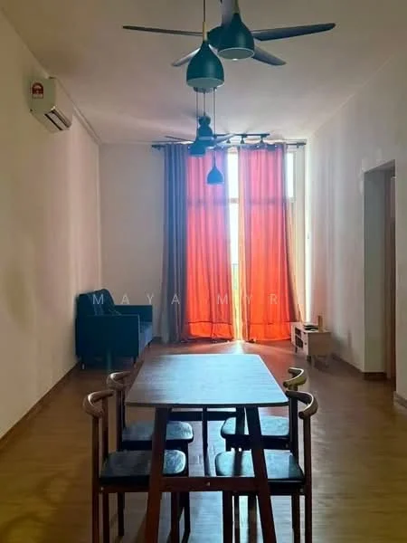 Dining features: wooden dining table, 4 black chairs, 5-blade ceiling fan with light, wall-mounted split AC, large window with orange curtains, laminate flooring, white painted walls; style: modern. Living features: black sofa, laminate flooring, white painted walls, large window with orange curtains; style: modern.