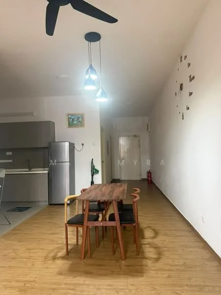 Dining features: wooden dining table, 4 wooden dining chairs, pendant lighting with three bulbs, light wood flooring, white walls, wall clock, open layout to kitchen, refrigerator visible in background; style: modern. Kitchen features: grey cabinetry, stainless-steel refrigerator, countertop, kitchen sink, open layout to dining area; style: modern.