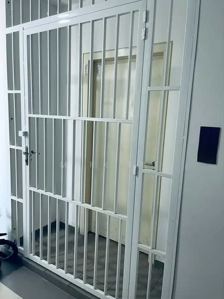 Room features: metal security gate, white painted walls, grey tiled flooring, wooden door, door handle, wall-mounted intercom panel; style: modern.