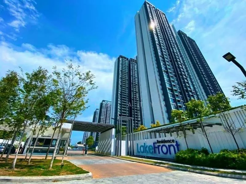 Exterior type: high-rise condominium; features: glass curtain wall, white painted facade, surrounded by mature greenery, manicured lawn, paved walkway, main entrance gate with signage, multiple high-rise towers, blue sky, modern architectural design; style: modern.